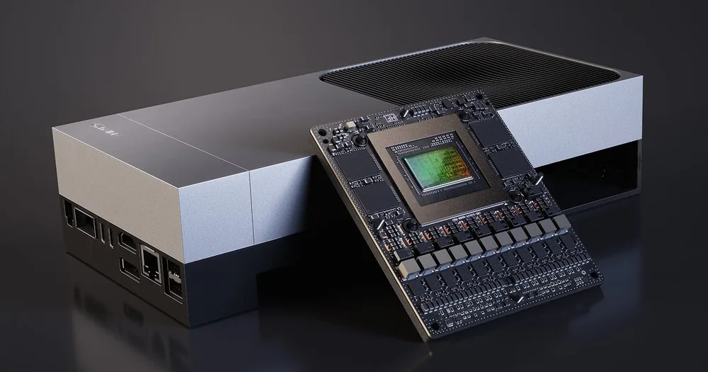 An NVIDIA Jetson AGX Thor developer kit: a silver and black enclosure with a finned top, and the bare Thor compute module leaning against its front.